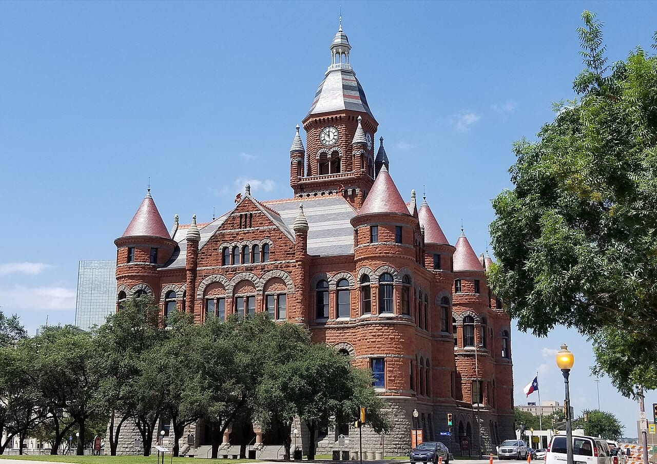 A Texas flag by the historic Dallas County Courthouse.